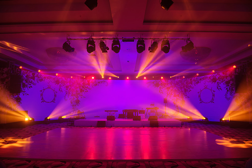 Wedding dance party zone with light show. Pink red and violet style
