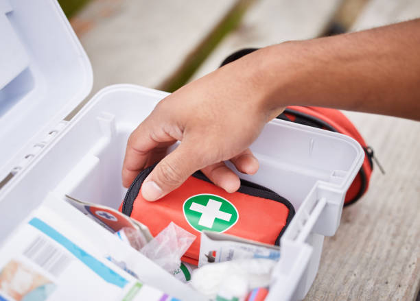 istock High angle shot of an unrecognizable male paramedic looking in his first aid kit while standing outside 1369531604
