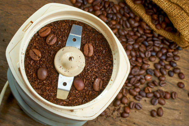 istock close up on an electric coffee grinder with coffee beans. shallow focus effect. soft focus. 1369532759