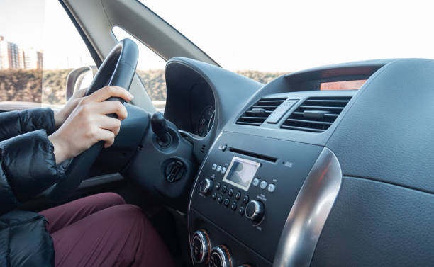 istock Hand Holding a Steering Wheel Driving 1369536285