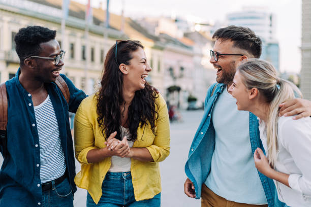 istock Friends having fun outdoors in the city. 1369536849