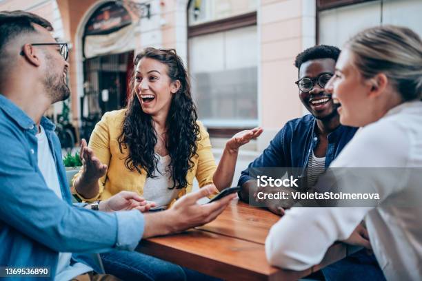 Young Friends Enjoying A Coffee Together Stock Photo - Download Image Now - Friendship, Restaurant, Happiness