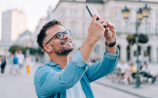 istock Male tourist taking a photo. 1369536909
