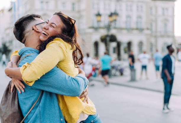 istock Happy couple hugging outdoors. 1369536913