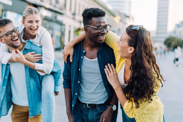istock Friends having fun outdoors in the city. 1369536917