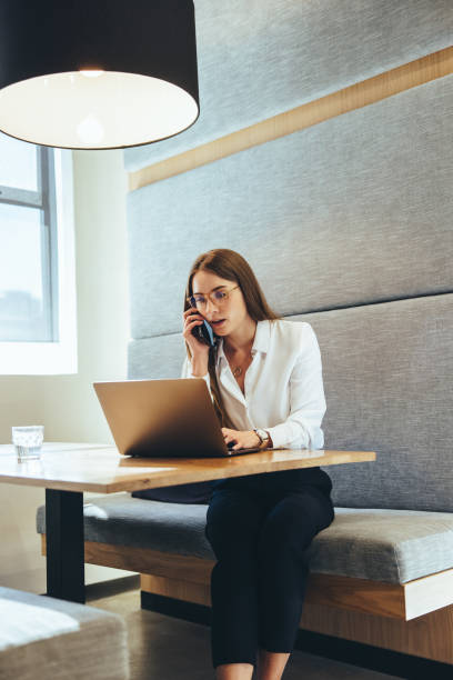 istock Female business professional speaking on a phone call 1369537401