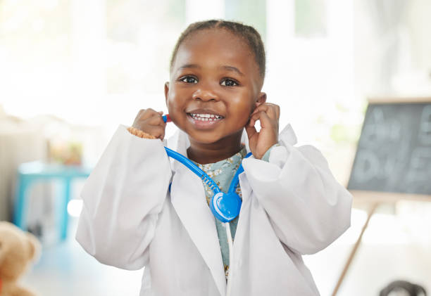 Shot of a little girl playing dress up as a doctor One day patients will come to me cute black babys stock pictures, royalty-free photos & images