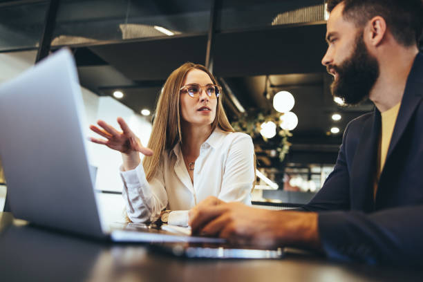 istock Businesspeople having a discussion in an office 1369541550