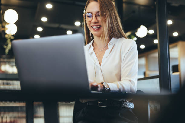 istock Female entrepreneur taking a video call in an office 1369541700