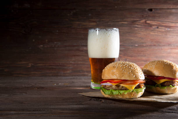 istock Hamburger and dark beer in vintage style 1369542255