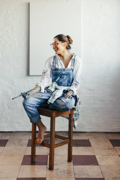istock Happy young painter looking away with a smile 1369542928