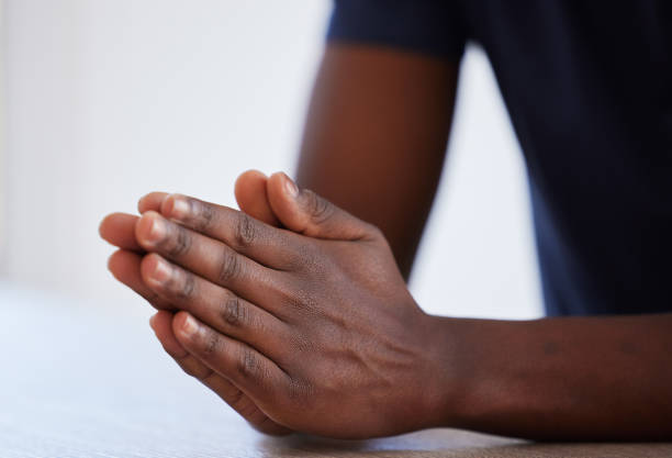 istock Studio shot of an unrecognisable man praying 1369543298