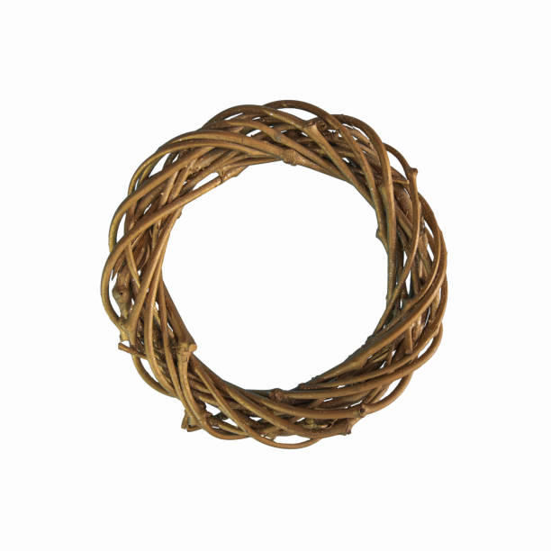 istock Christmas wreath made of twigs with gilding. Square format. Close-up, texture. On a white background 1369543390