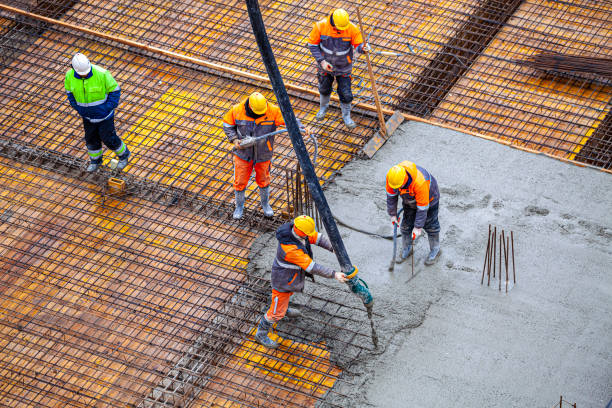 istock Concrete pouring on the construction site. 1369546585