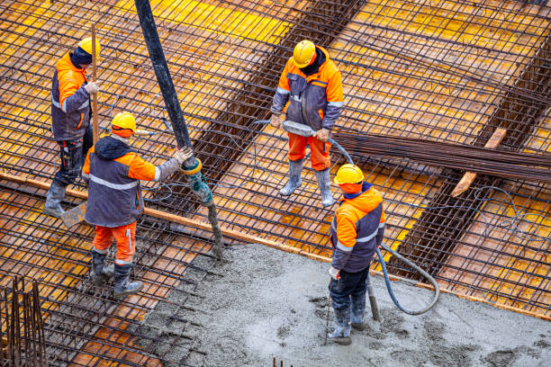 istock Concrete pouring on the construction site. 1369546602