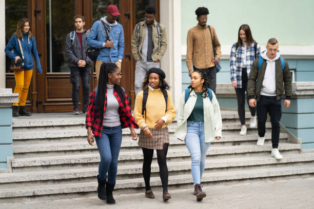 istock Multiethnic group of students leaving the University 1369549215