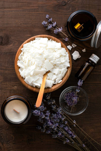istock Ingredients for making soy candles on a wooden background. 1369549225