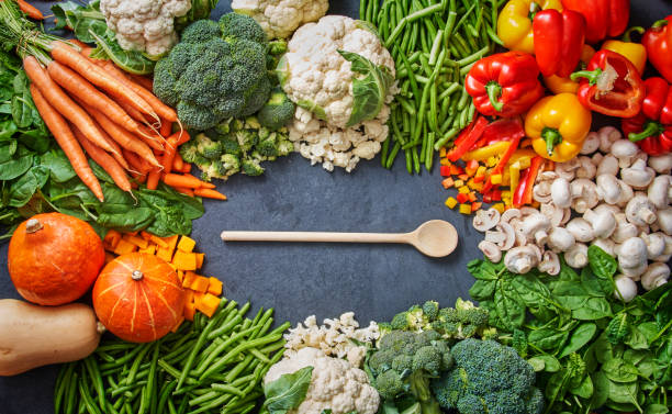 istock lots of fruit and vegetable with a spoon in the middle 1369550565