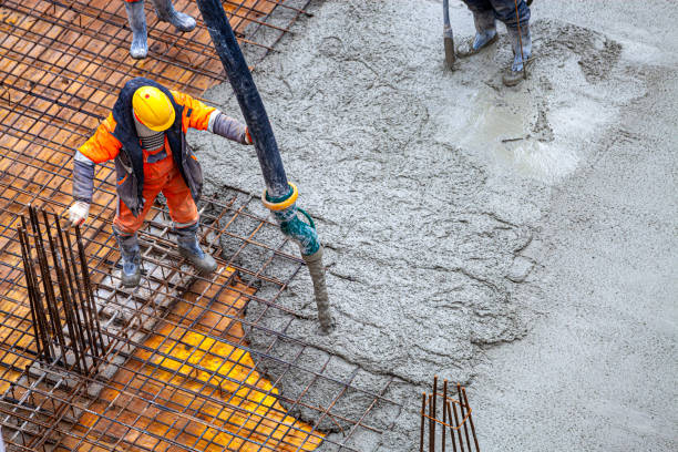 istock Concrete pouring on the construction site. 1369551894