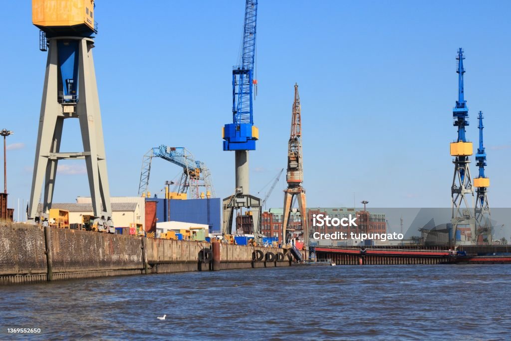 Port of Hamburg, Germany Hamburg, Germany - port seen from river Elbe. Industrial harbor cranes. Port Of Hamburg Stock Photo