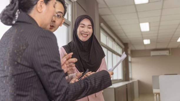 istock Gender, cultures and dynamic in business office 1369553523