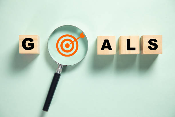 istock Goal wording with magnifying glass. 1369554721