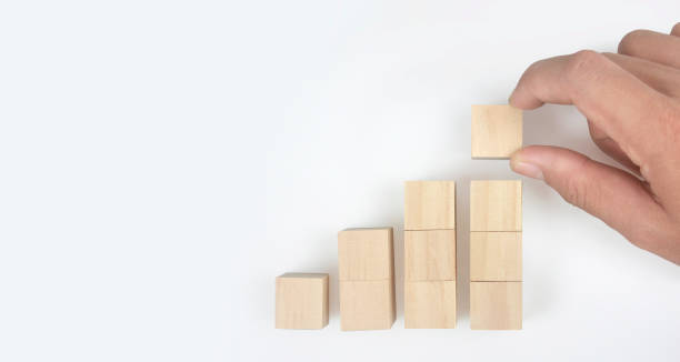 Wooden blocks chart steps with copy space. The business growth process stock photo