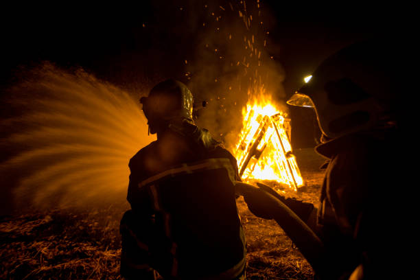istock Fire brigade in action at night time 1369556086