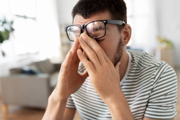 istock tired man with glasses at home office 1369556187