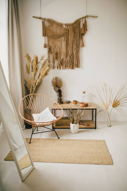 istock Interior in bohemian style with macrame hanging on the wall. 1369559096