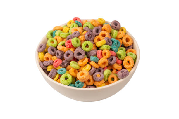 istock Colorful rings cereal spill out into a bowl. Breakfast. Isolated. 1369559565