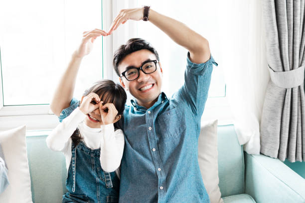 istock father and daughter at home 1369559636