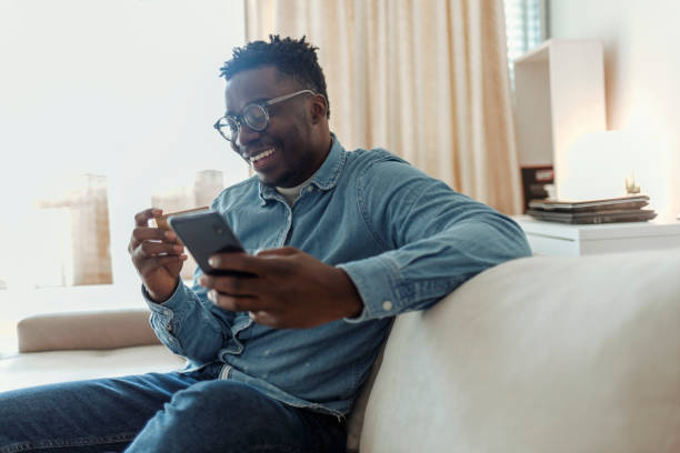 istock Man making online credit card payment. 1369560902