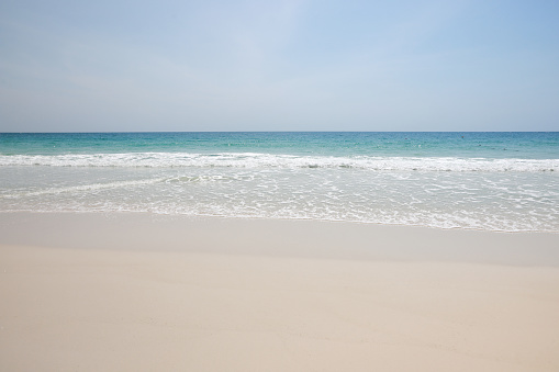 Natural background of white sand beach on island, Summer beach background. Sand and sea and sky