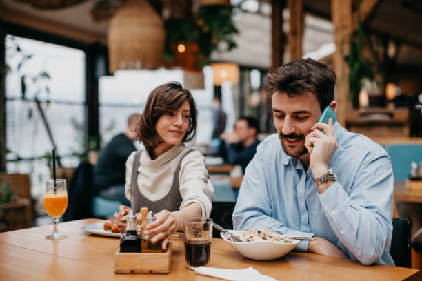istock Stop using a phone while having lunch, enjoy in the moment 1369561620