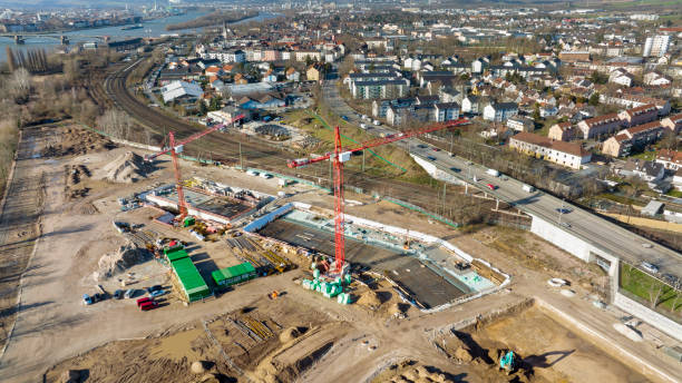 istock Large construction site, equipment - aerial view 1369562665