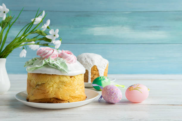 Easter traditional cake on a wooden table for the holiday. Easter traditional cake with eggs on a wooden table on a blue background for the holiday. orthodox church easter stock pictures, royalty-free photos & images