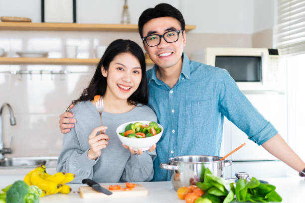 istock image of a couple cooking together 1369563193