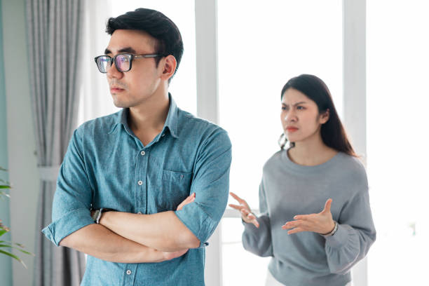 istock Asian couple arguing at home 1369563383
