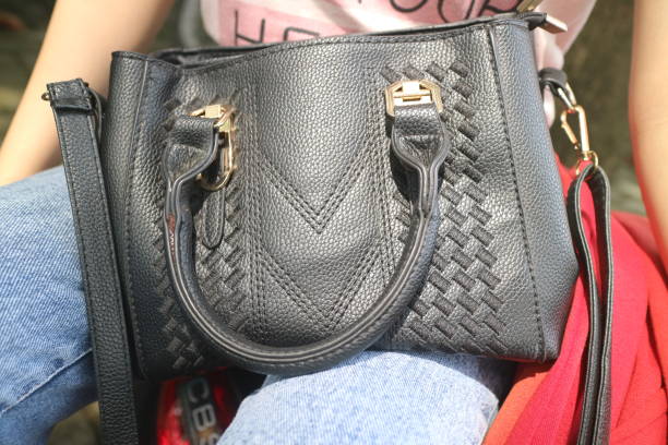female accessory leather bag on a white background.