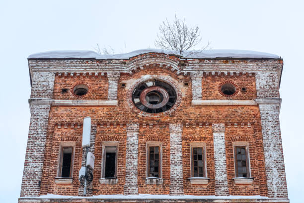 istock Old clock on the facade of the building 1369567775