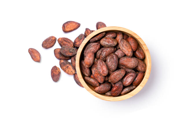 cocoa beans in wooden bowl - chocolate beans imagens e fotografias de stock