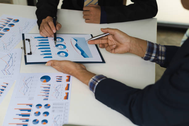istock Team work, investment strategy analysis and business planning. 1369569863