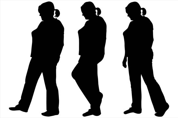 Three black female silhouettes isolated on white background. Side view. A series of steps for animation. Step by step. Storyboard of a walking woman. Women in pants, trousers and a T-shirt, blouse. Three black female silhouettes isolated on white background. Side view. A series of steps for animation. Step by step. Storyboard of a walking woman. Women in pants, trousers and a T-shirt, blouse. walking animation stock illustrations