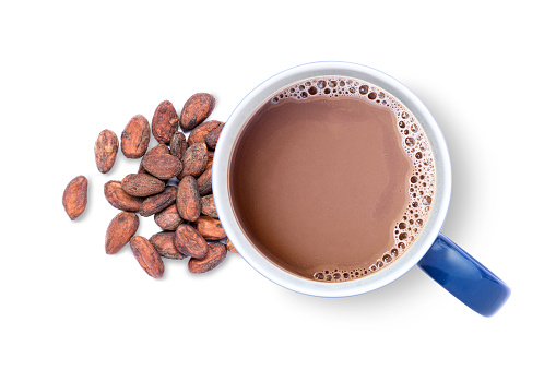 Hot chocolate cocoa drink with roasted cocoa beans isolated on white background, top view, flat lay.