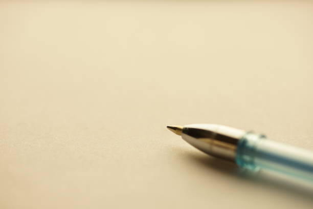 istock Ballpoint pen on clean paper. Macro photo. 1369572386