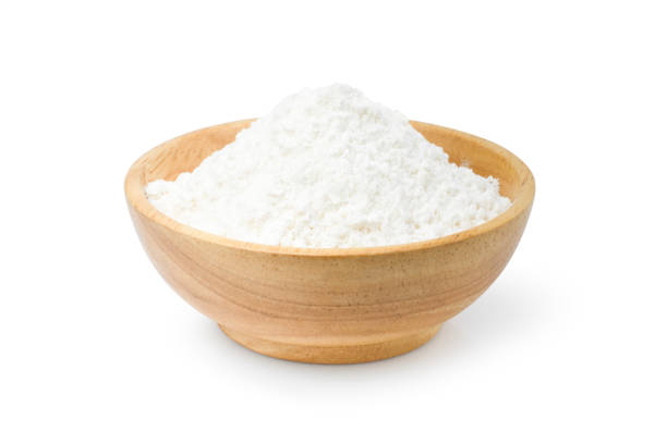 istock White flour in wooden bowl isolated on white 1369572573