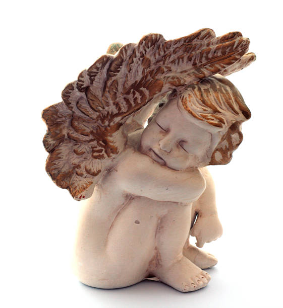 istock Figurine of an angel on a white background 1369573496