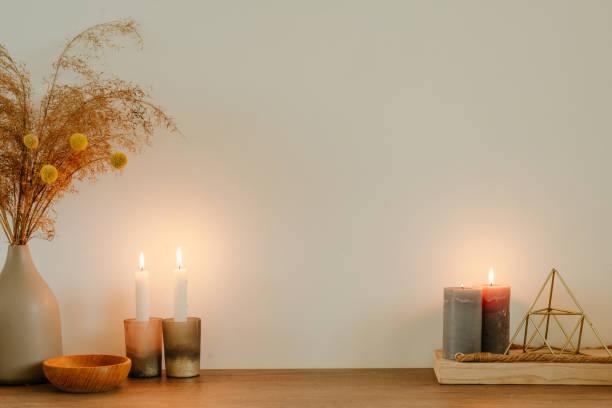 istock Candles, dried flowers pampas grass in the ceramic vase 1369573906