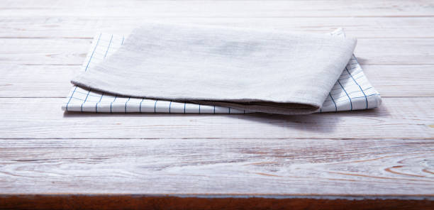 istock Napkin, table cloth on wooden deck mockup. 1369575185